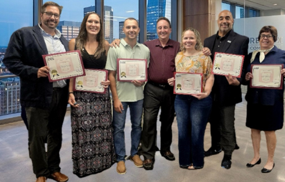 Re/Max Revolution Commercial team grows with Top Dogs graduation